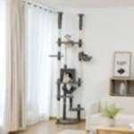 DualTower floor-to-ceiling cat tree in grey variant in a living room DualTower floor-to-ceiling cat tree in grey variant in a living room